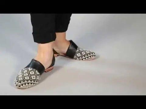 Women's black and white geometric print loafers with leather accents, stylish casual footwear