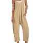Beige women's jumpsuit with pockets, white sneakers, straw hat — casual summer fashion