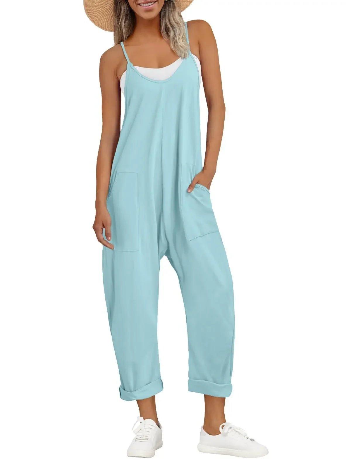 Light blue women's jumpsuit with pockets, straw hat, white sneakers – casual summer fashion