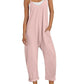 Pink women's jumpsuit with pockets, white sneakers, straw hat — casual summer fashion