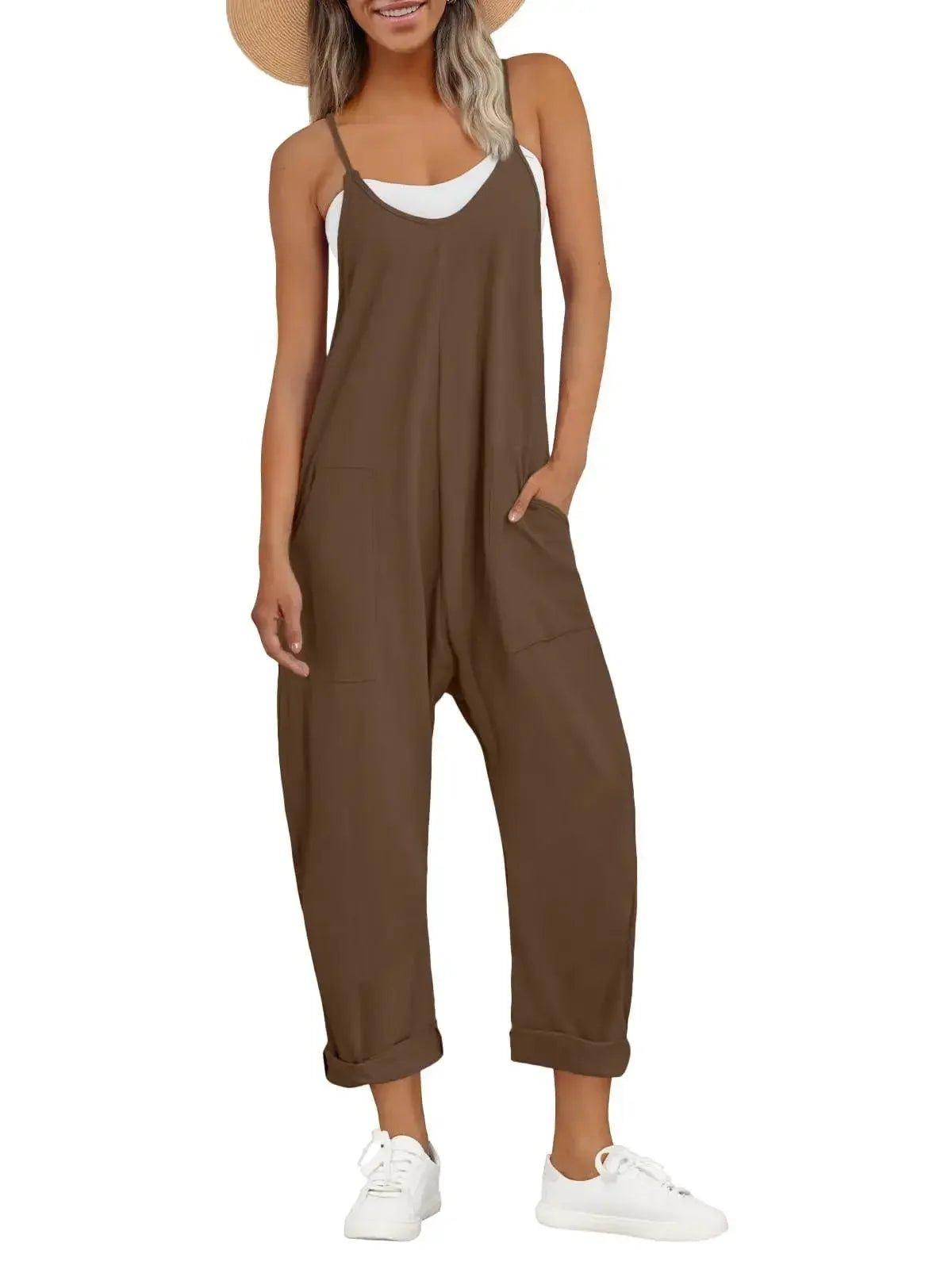 Brown women's jumpsuit with pockets, white sneakers, and straw hat for casual fashion