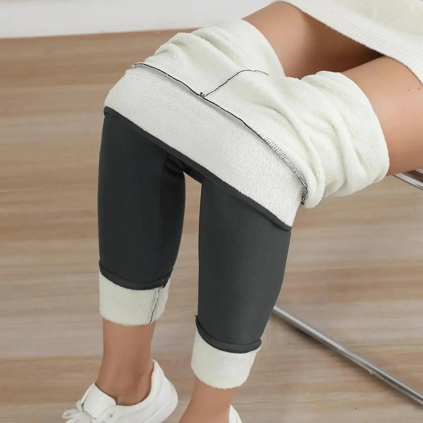 Cozy black leggings with white fleece lining, perfect for women's fashion and comfort.