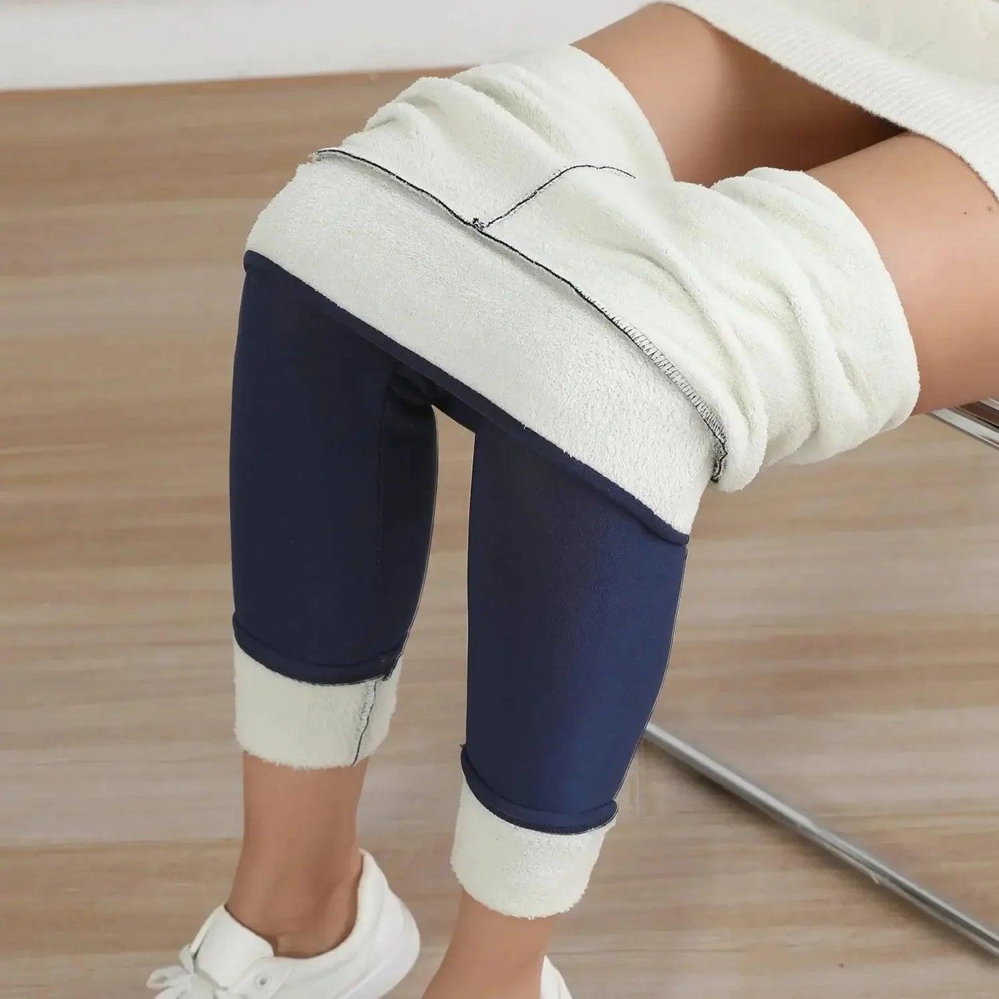 Cozy navy blue leggings with white fleece lining, perfect for women's fashion and comfort.