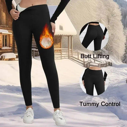 Black butt-lifting tummy-control leggings with flame graphic, worn in snowy setting