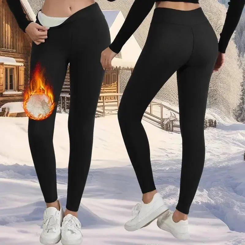 Black thermal leggings for women, cozy winter wear with flame graphic, snow backdrop