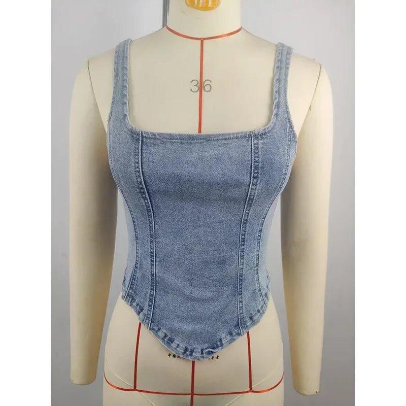 Women's denim corset top with square neckline, fitted waist, and adjustable straps on mannequin