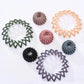 Assorted women's hair scrunchies in multiple colors and styles for everyday fashion