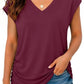 Women's burgundy V-neck short sleeve top with ruched side, paired with distressed denim shorts