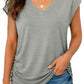 Gray V-neck women's fashion top with ruched side, paired with distressed denim shorts for casual summer style