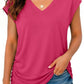 Pink V-neck women's t-shirt with ruched side, paired with denim shorts for casual summer fashion