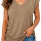 Woman wearing olive V-neck t-shirt with ruched side, paired with distressed denim shorts for casual summer fashion.