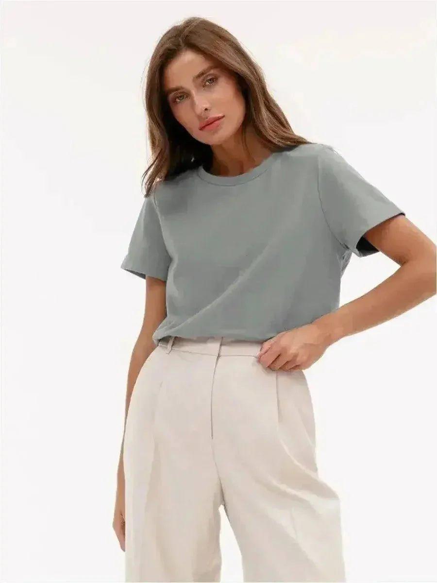 Woman wearing casual gray t-shirt and white wide-leg pants, stylish everyday outfit