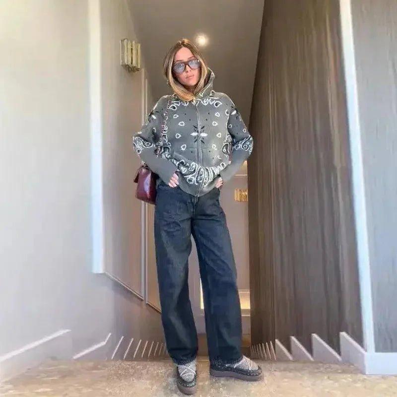 Woman in stylish bandana print hoodie, wide-leg jeans, and platform loafers for casual fashion