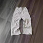 Gray women's sweatpants with side stripes, casual lounge wear on wood floor