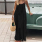 Woman in black maxi dress with straw bag, summer fashion outfit