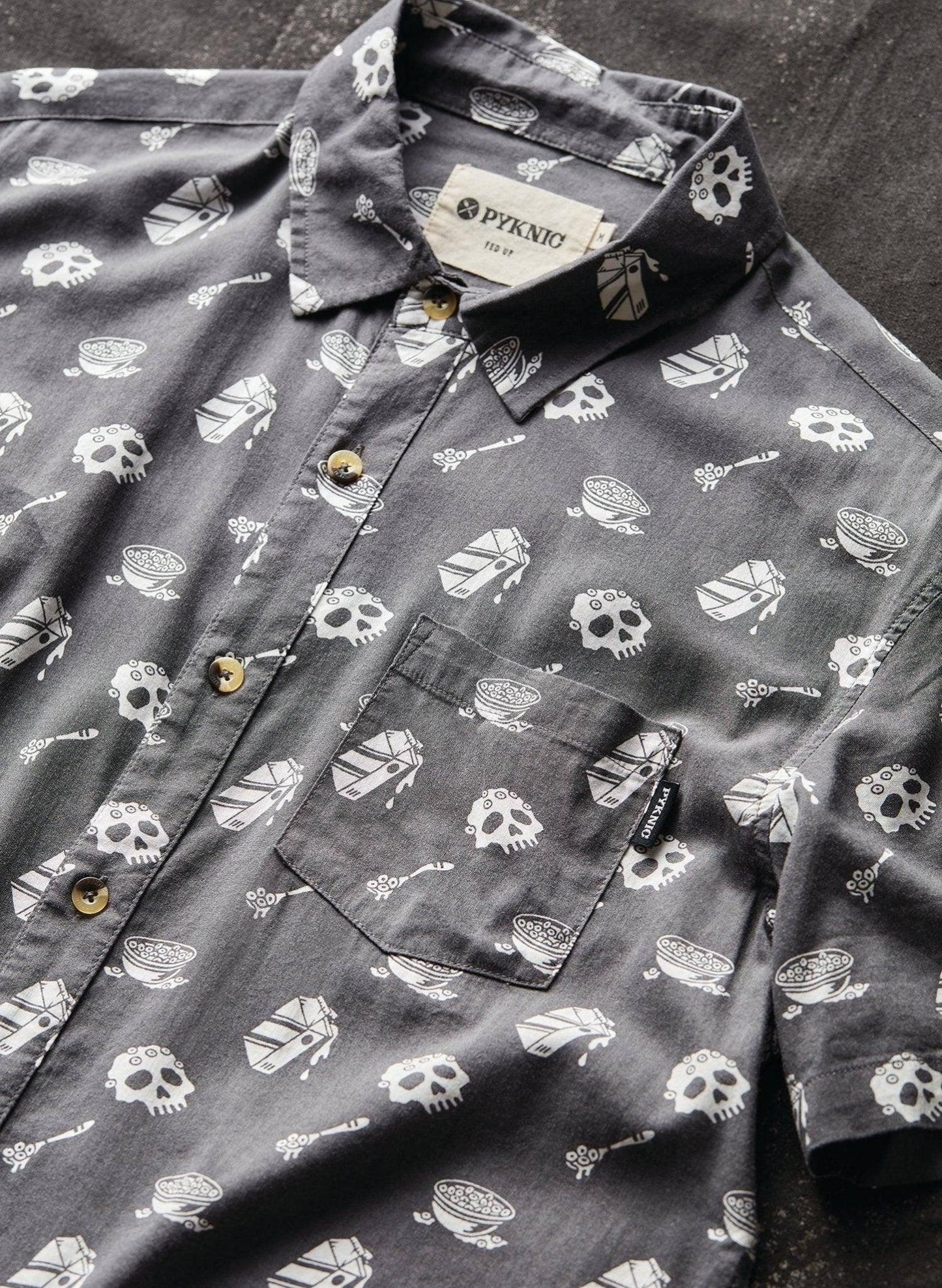 Gray button-up shirt with skull and cereal bowl print, casual fashion top