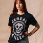 Woman wearing black 'Cereal Killer' graphic tee with skull design, casual fashion style