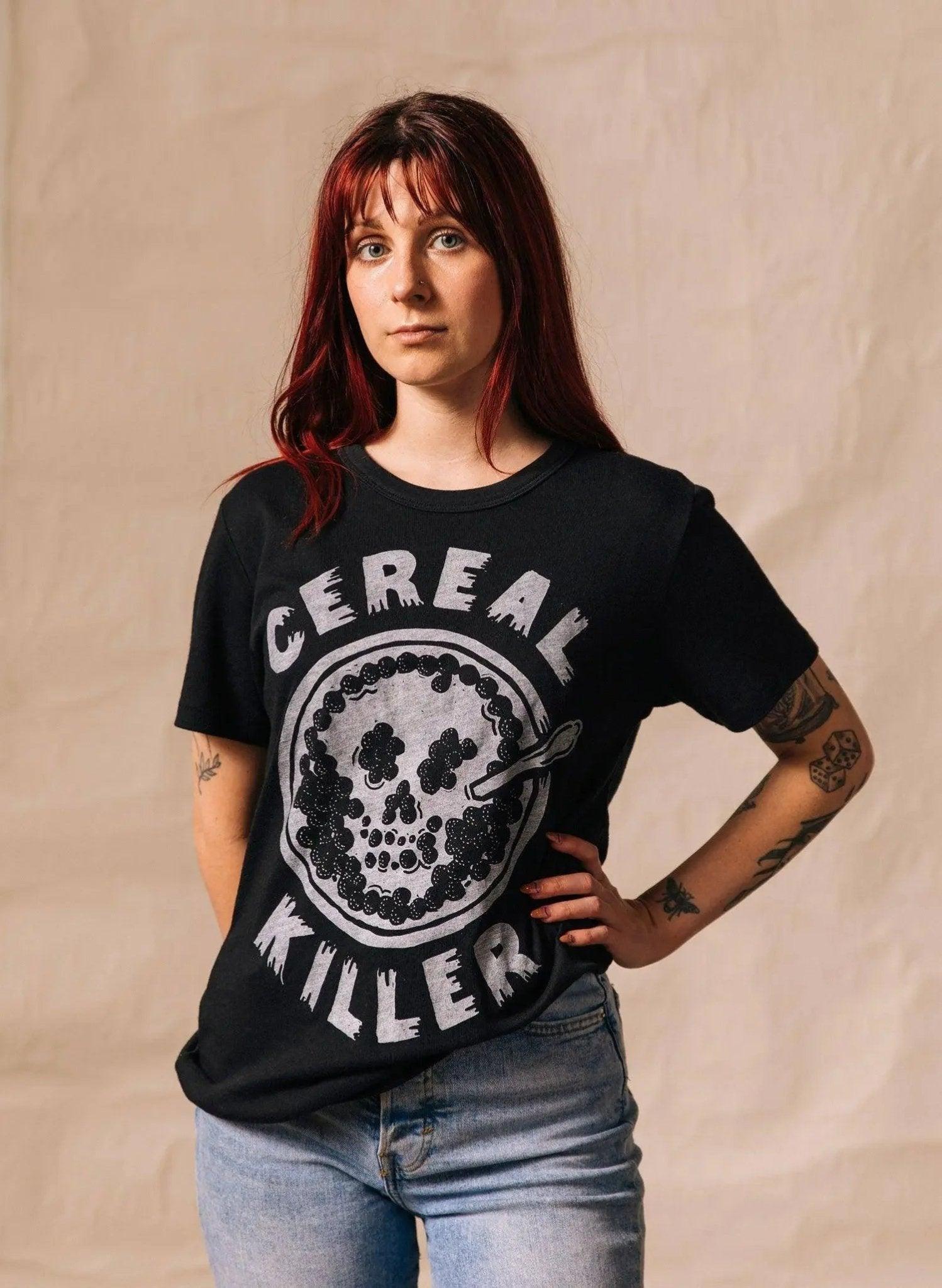 Woman wearing black 'Cereal Killer' graphic tee with skull design, casual fashion style
