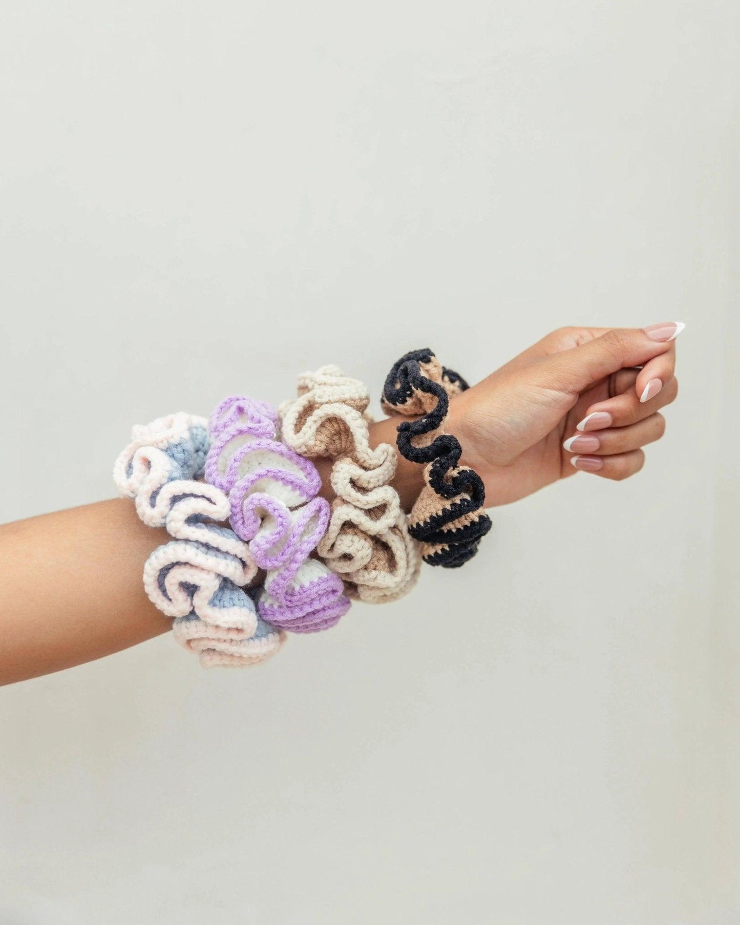 Crochet hair scrunchies in pastel and neutral colors, stylish women's fashion accessories