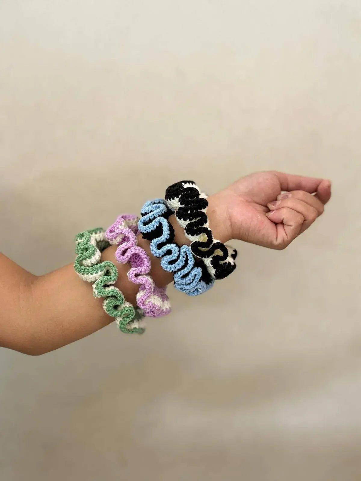 Colorful crochet hair scrunchies on wrist, women's fashion accessories
