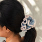 Blue and pink crocheted flower hair scrunchie in dark ponytail, women's fashion accessory