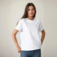 Woman modeling a plain white t-shirt with jeans, casual fashion outfit