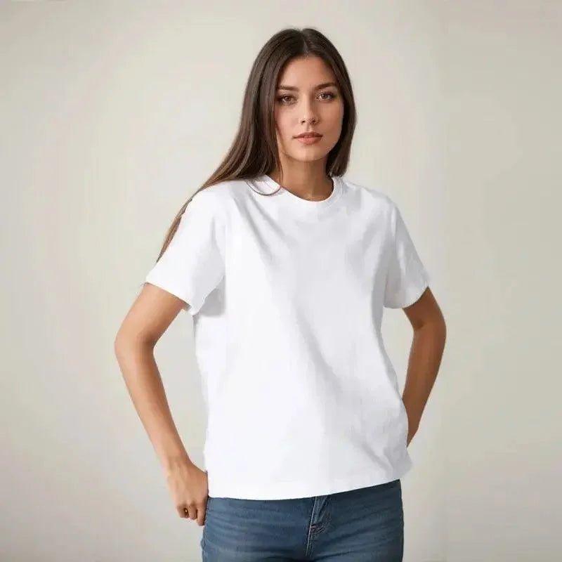 Woman modeling a plain white t-shirt with jeans, casual fashion outfit