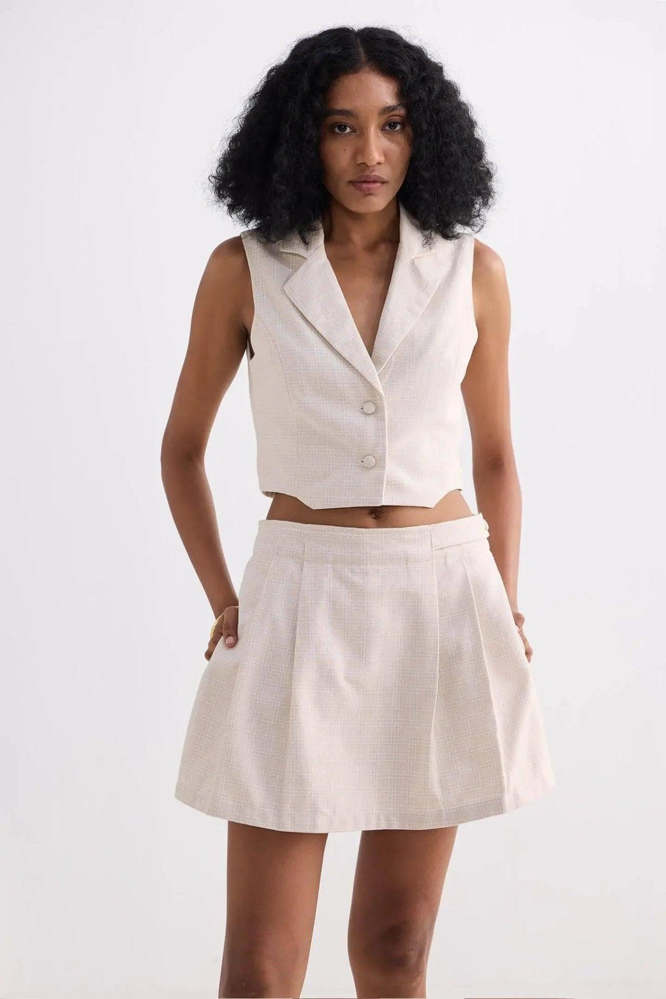 Cream sleeveless blazer vest and pleated mini skirt set for women's fashion