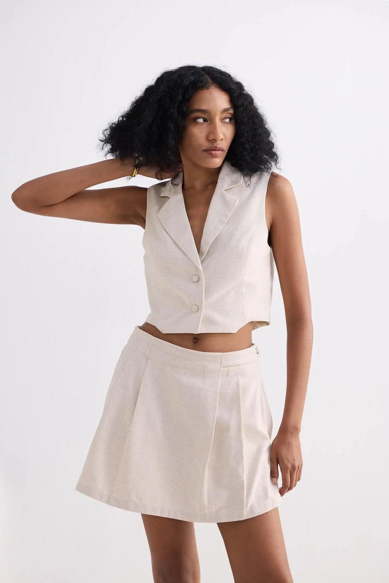 Cream sleeveless blazer vest and pleated mini skirt set for women's fashion