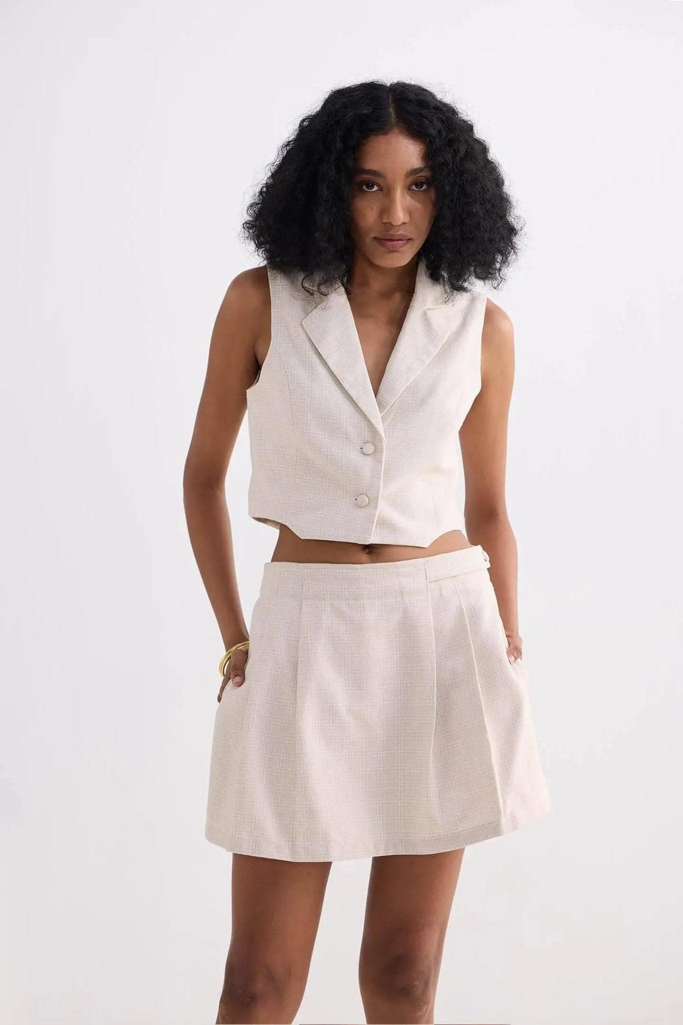 Cream sleeveless blazer vest and pleated mini skirt set for women's fashion