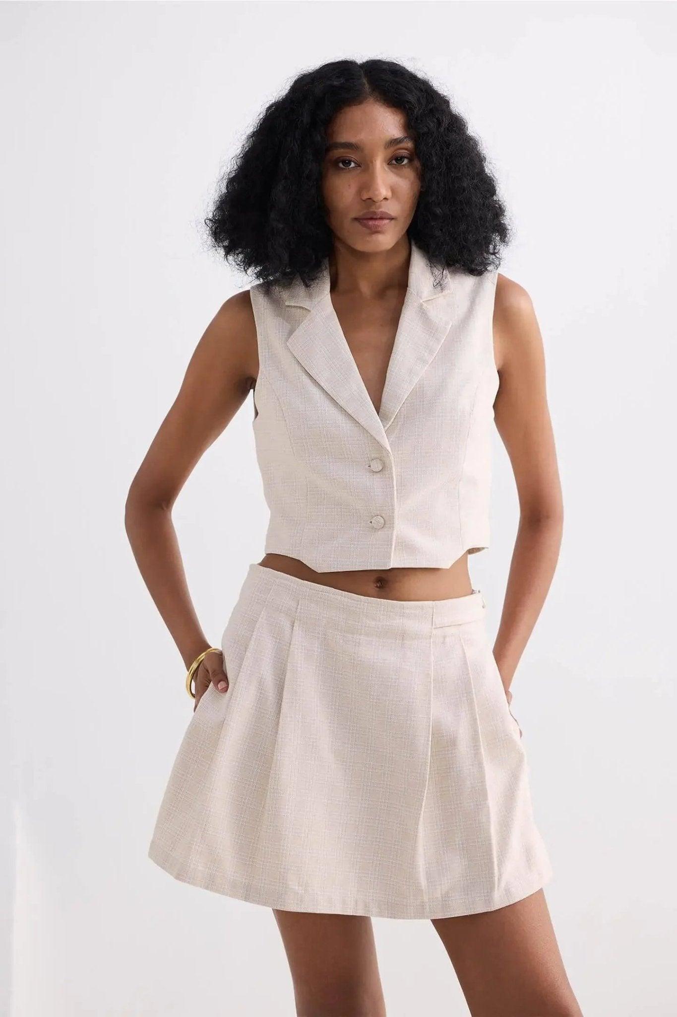 Cream sleeveless blazer vest and pleated mini skirt set for women's fashion
