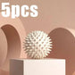 White spiky massage ball for muscle relief, 5pcs set on minimalist stand