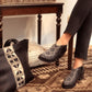 Black patterned ankle boots with matching tote bag, stylish women's fashion footwear