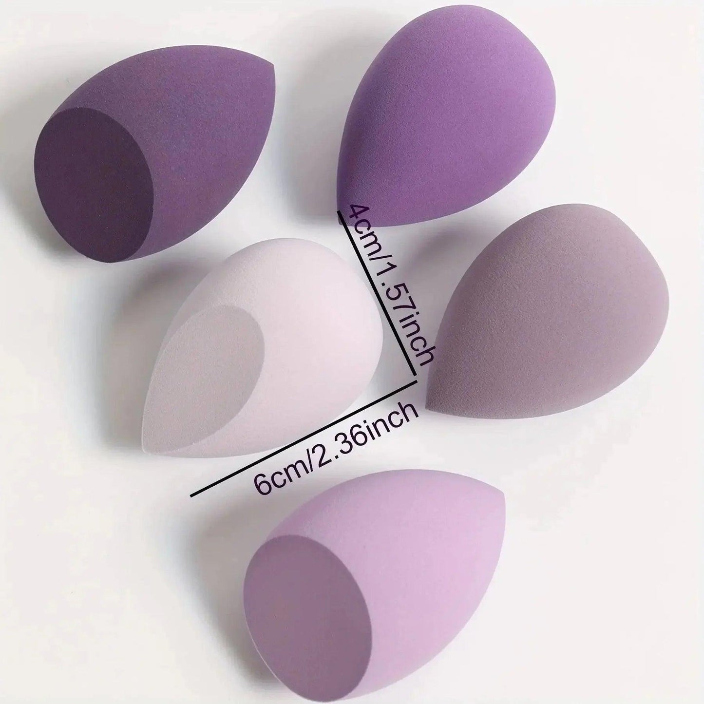 Purple and pink makeup sponges in various sizes for beauty application, ideal for women's fashion and cosmetics routines.