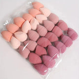 Pink and peach makeup sponges in clear packaging for beauty and fashion routines
