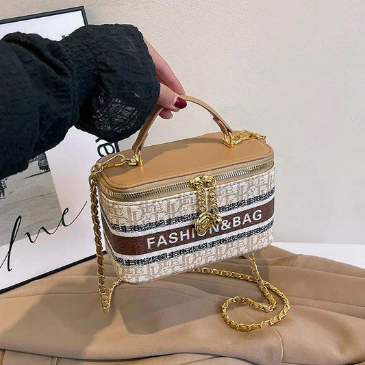 Stylish women's fashion handbag with gold chain strap and 'FASHION&BAG' print, perfect for trendy outfits