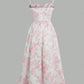 White midi dress with pink floral print, thin straps, and flared skirt for women's fashion