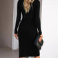 Black ribbed midi dress with long sleeves, styled with a clutch for women's fashion