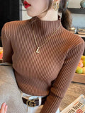 Brown ribbed turtleneck sweater for women, stylish fall fashion with gold necklace and belt