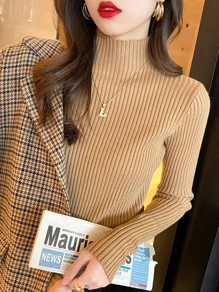 Woman in ribbed turtleneck sweater and plaid blazer, fashion outfit with gold jewelry