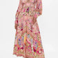 Pink floral maxi dress with long sleeves, V-neck, and gold trim for women's fashion