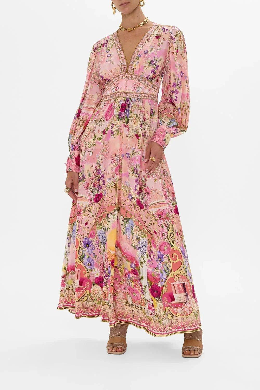 Pink floral maxi dress with long sleeves, V-neck, and gold trim for women's fashion