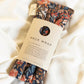 Floral neck wrap therapy pack for relaxation, soothing aches with natural lentils, perfect for beauty and fashion wellness.