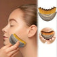 Woman using dual-sided facial brush for skincare routine, featuring soft bristles and textured exfoliator