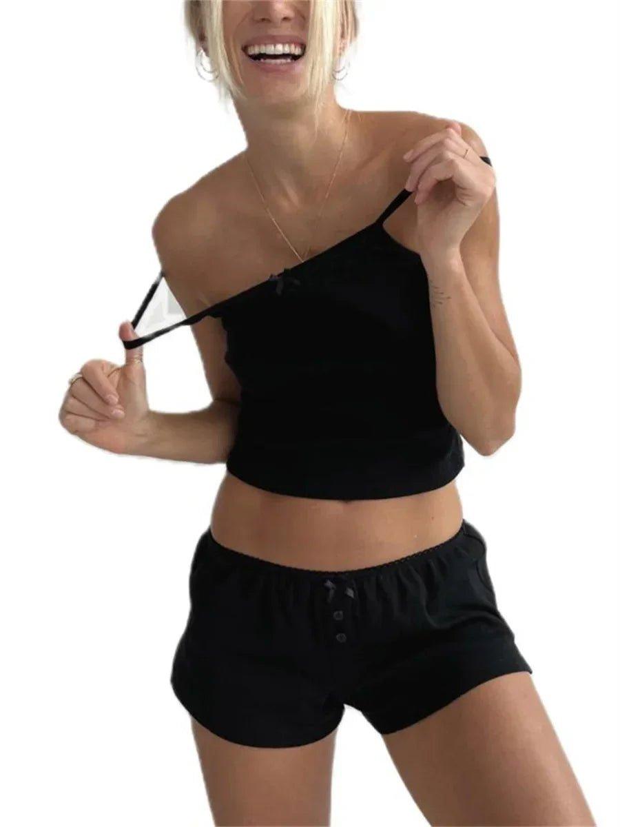 Woman in black one-shoulder crop top and shorts, stylish casual fashion set