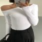 White off-shoulder long sleeve top with black high-waist pants, women's fashion outfit
