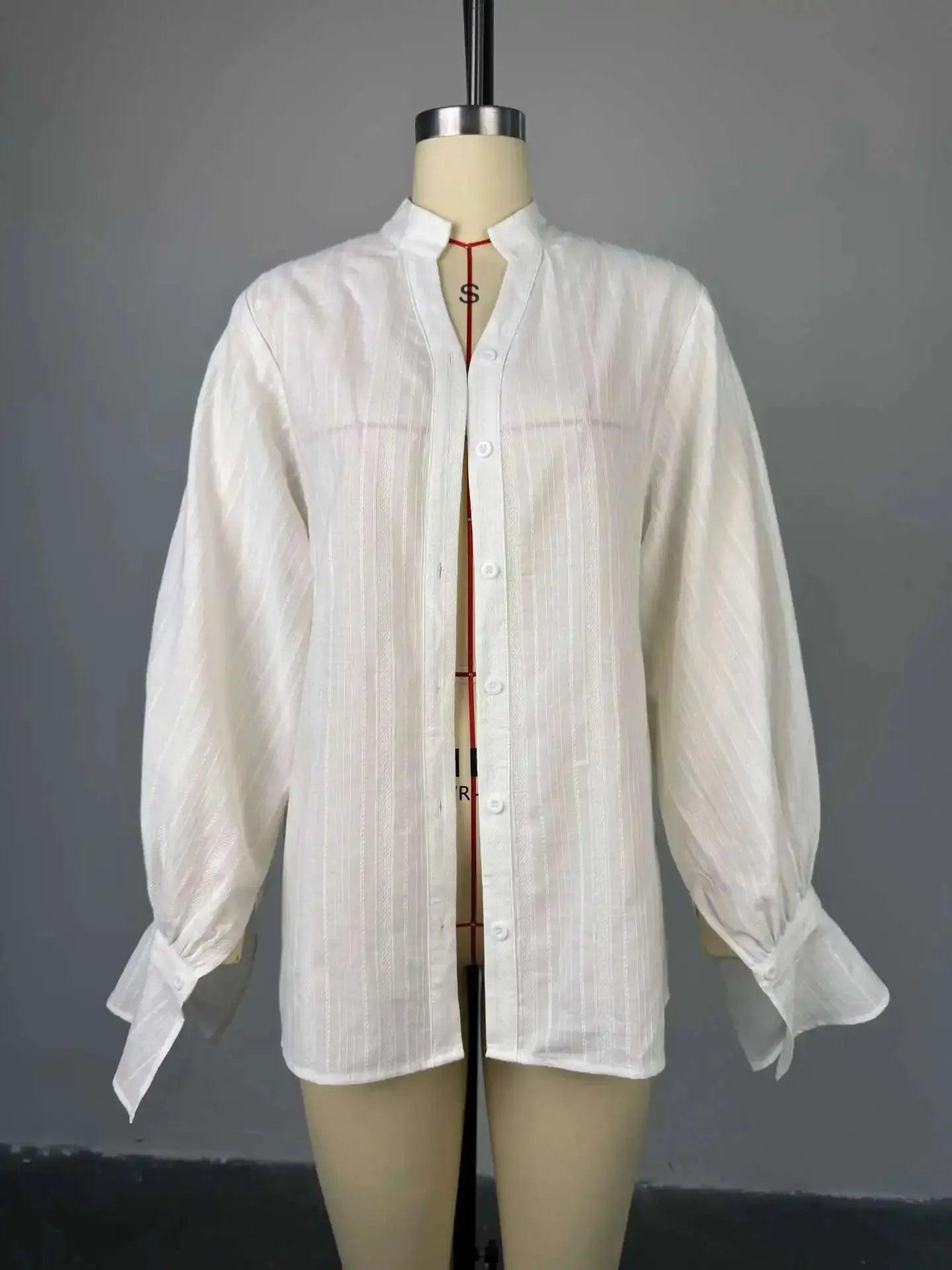 White striped button-up blouse with long puff sleeves on mannequin, women's fashion top