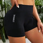 Black high-waisted gymwear shorts with 'GYMWEAR' text, women's fitness apparel