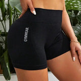 Black high-waisted gym shorts with GYMWEAR text, women's fitness wear, stylish activewear for workouts