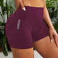 Purple high-waist gym shorts with GYMWEAR text, women's fitness wear, stylish active apparel